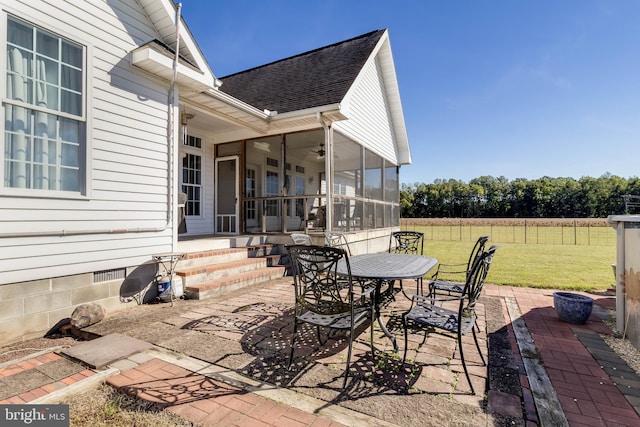 view of patio / terrace featuring a sunroom