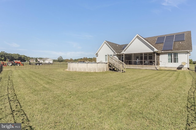 view of yard with a sunroom