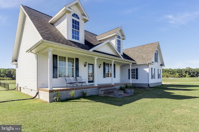 new england style home featuring a front lawn