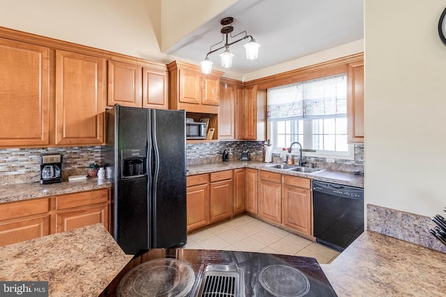 kitchen featuring pendant lighting, light tile patterned floors, sink, tasteful backsplash, and black appliances