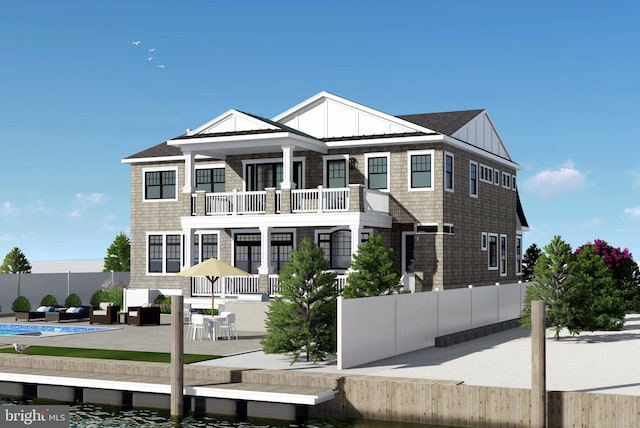 view of front facade with a patio, a balcony, and an outdoor hangout area