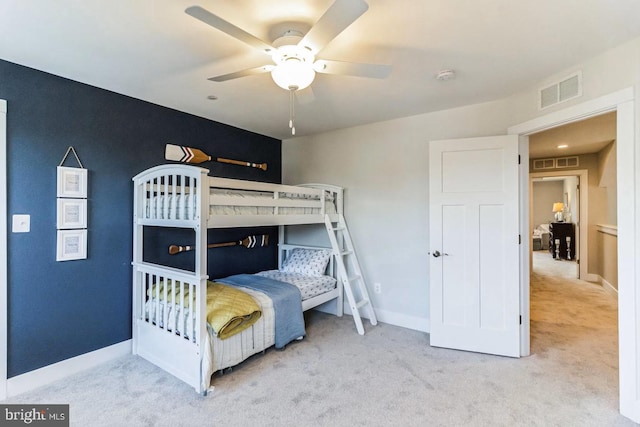 bedroom with light colored carpet and ceiling fan