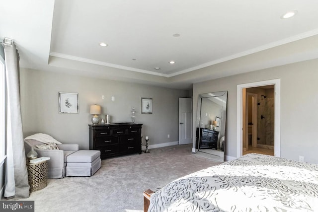 bedroom with light carpet, crown molding, ensuite bathroom, and a raised ceiling