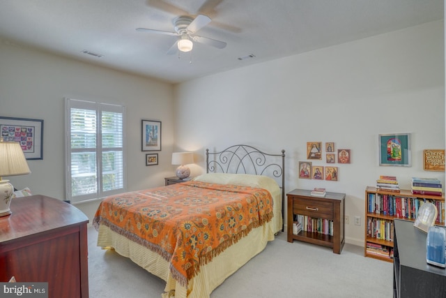 bedroom featuring ceiling fan and light colored carpet