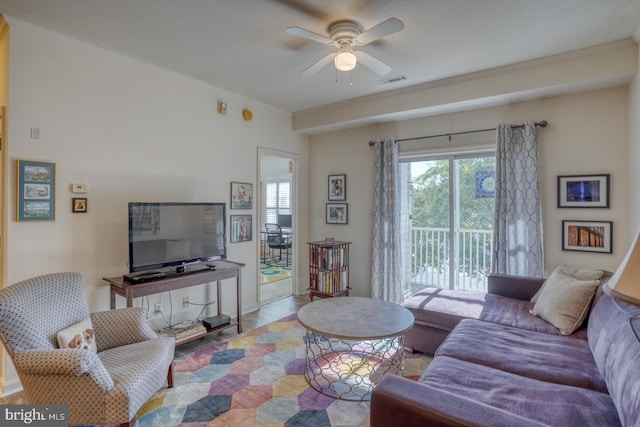 living room featuring light wood-type flooring and ceiling fan