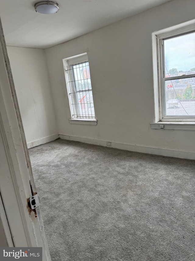 unfurnished room with carpet floors