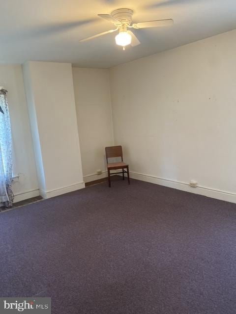 carpeted empty room with ceiling fan