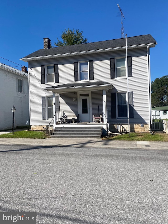 view of front property featuring central AC unit