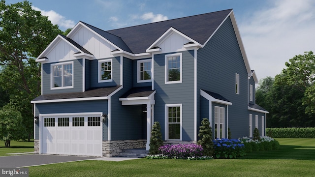 view of front of house with a front lawn and a garage