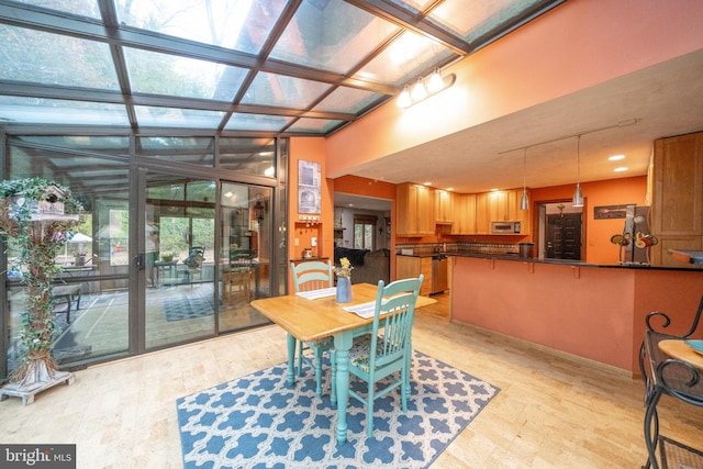 dining space with light hardwood / wood-style flooring