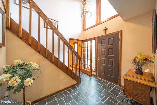 foyer entrance with an inviting chandelier