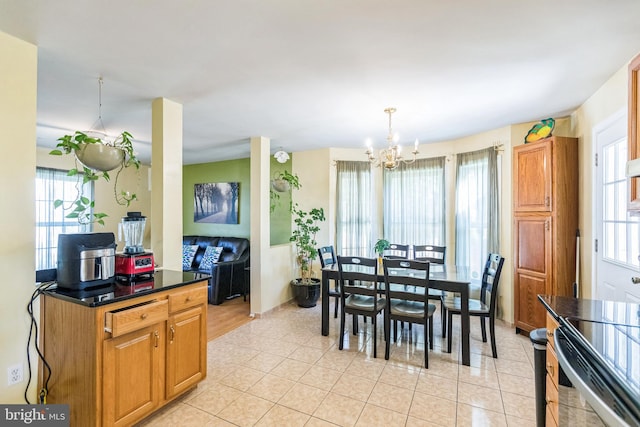 tiled dining room with a notable chandelier