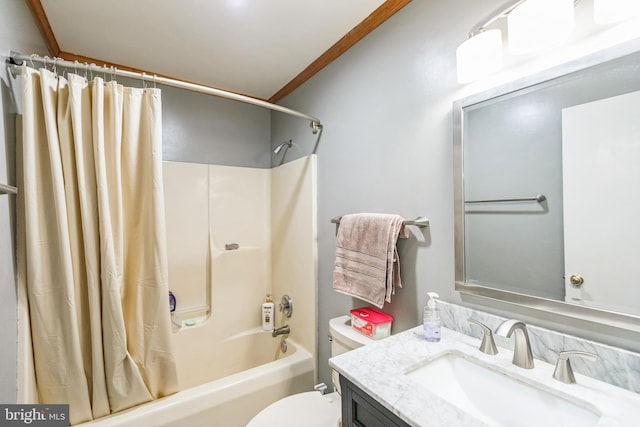 full bathroom featuring vanity, toilet, crown molding, and shower / tub combo with curtain