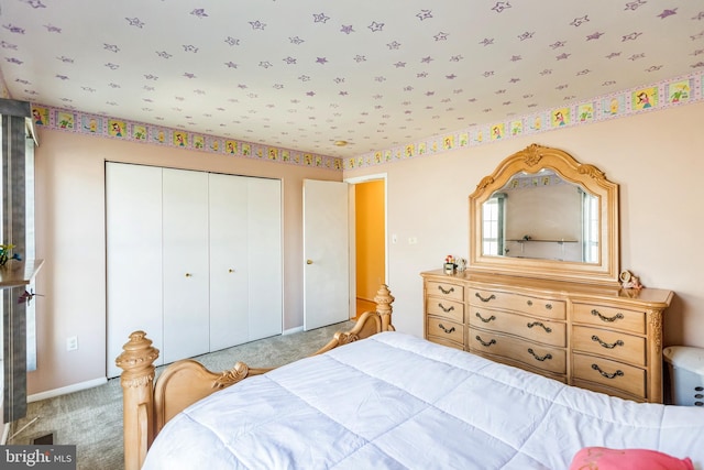 bedroom featuring a closet and carpet flooring