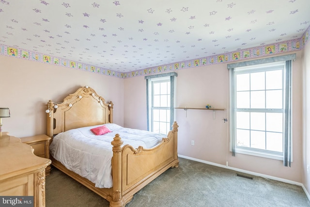 carpeted bedroom with baseboards and visible vents