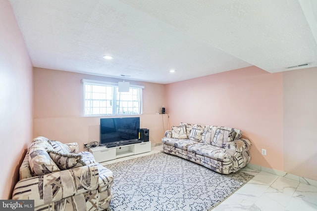 living room with visible vents, recessed lighting, and marble finish floor