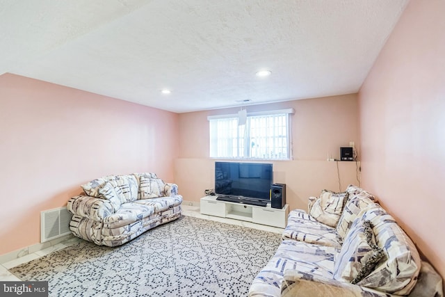 living room featuring a textured ceiling