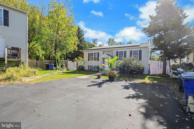 view of front of house with fence