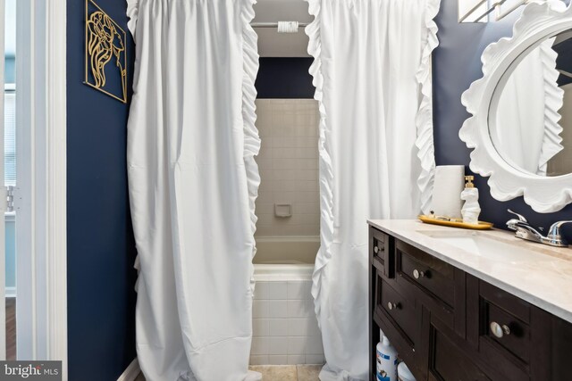 full bath featuring shower / tub combo with curtain and vanity