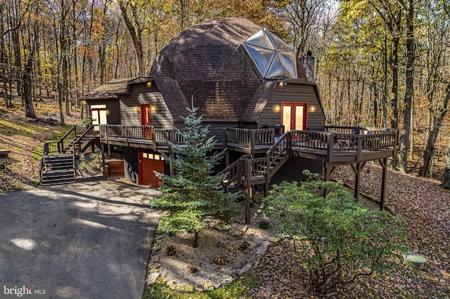 view of front of home featuring a wooden deck