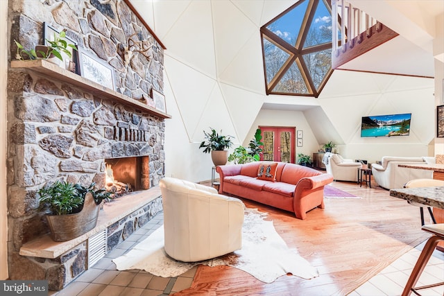 living room featuring a healthy amount of sunlight, hardwood / wood-style flooring, and a fireplace