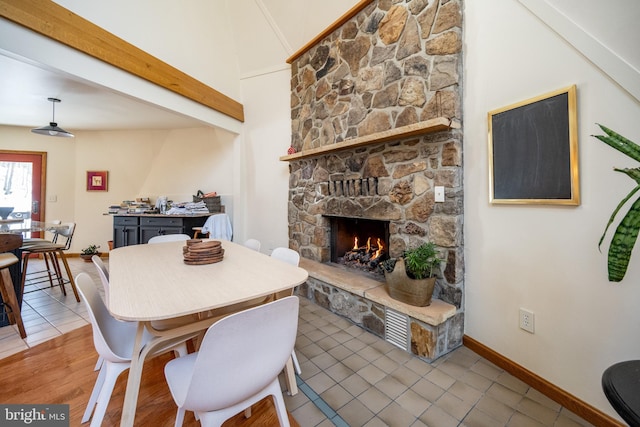 621 Paradise Hts, Oakland, MD 21550 - tiled dining space with baseboards and a fireplace