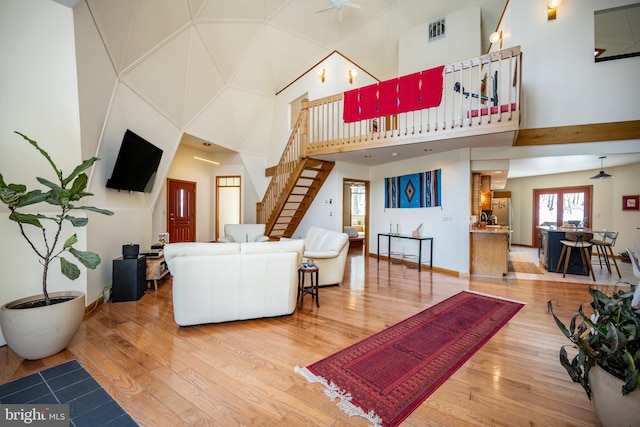 621 Paradise Hts, Oakland, MD 21550 - living area with a high ceiling, stairs, visible vents, baseboards, and wood finished floors