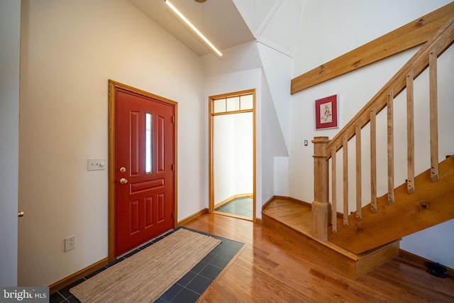 621 Paradise Hts, Oakland, MD 21550 - entryway featuring a towering ceiling, stairway, wood finished floors, and baseboards