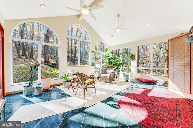 sunroom with lofted ceiling and ceiling fan