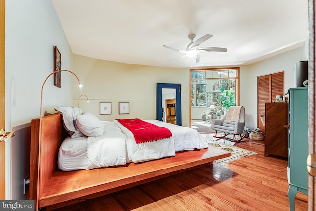 bedroom featuring hardwood / wood-style floors and ceiling fan