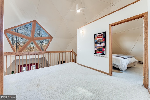 bonus room with ceiling fan and carpet flooring