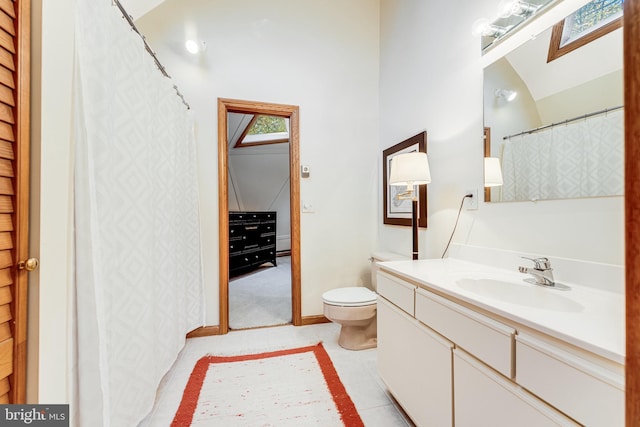 bathroom featuring vanity, toilet, and tile patterned flooring