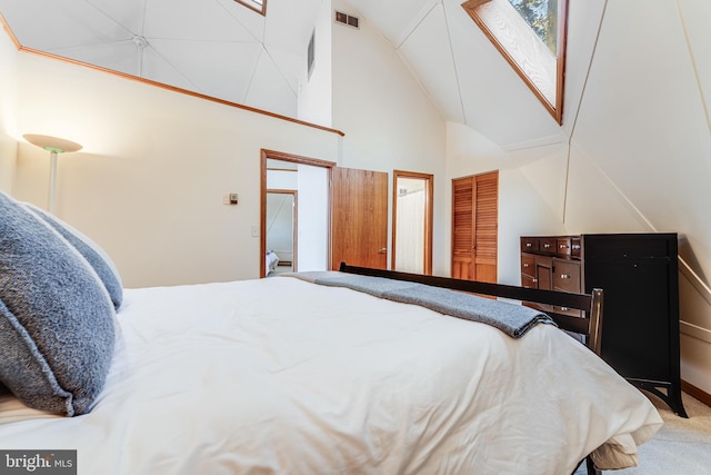 carpeted bedroom with vaulted ceiling