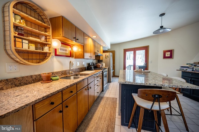 621 Paradise Hts, Oakland, MD 21550 - kitchen featuring stainless steel range with gas cooktop, a kitchen breakfast bar, open shelves, a sink, and a kitchen island