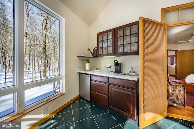 621 Paradise Hts, Oakland, MD 21550 - bar with dark tile patterned floors, vaulted ceiling, ceiling fan, dishwasher, and a sink