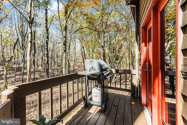 wooden terrace with area for grilling