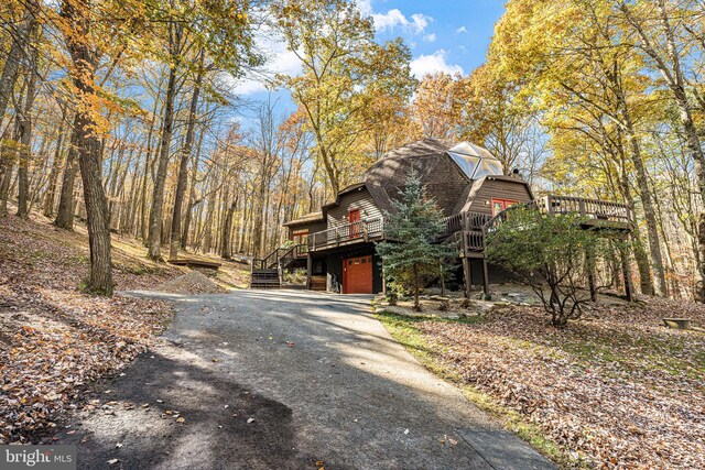 exterior space with a deck and a garage