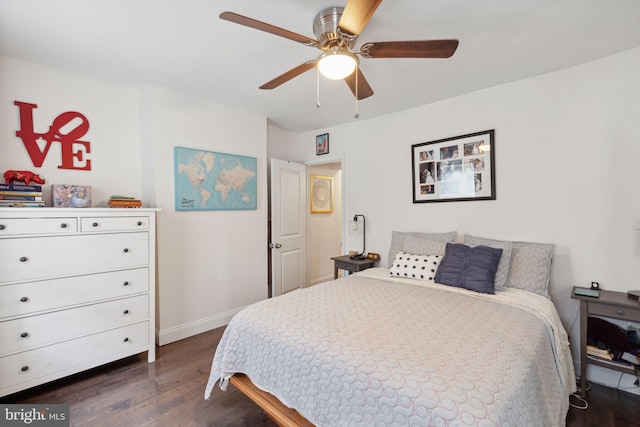 bedroom featuring dark hardwood / wood-style flooring and ceiling fan