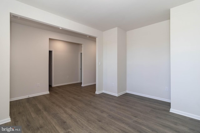 spare room featuring dark hardwood / wood-style floors