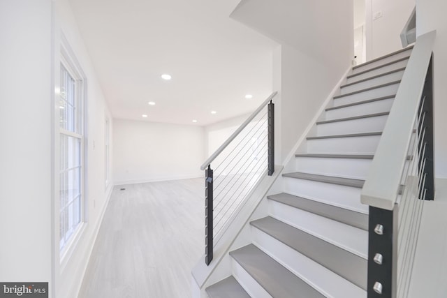 staircase featuring hardwood / wood-style floors