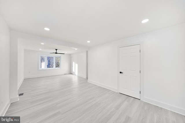 spare room with ceiling fan and light hardwood / wood-style flooring