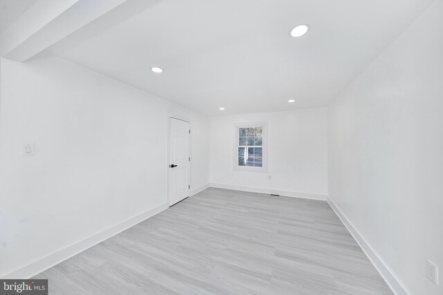 spare room with light wood-type flooring