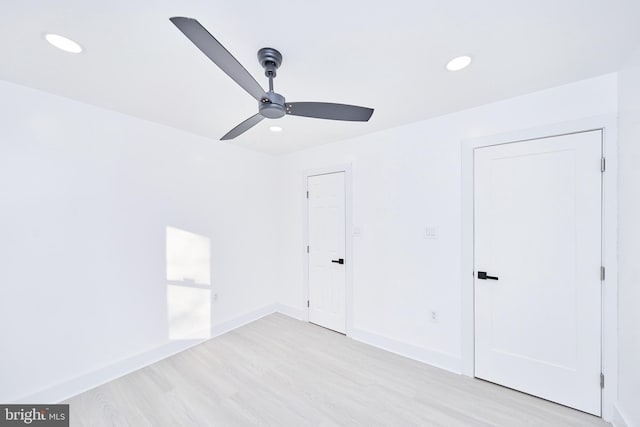 unfurnished bedroom featuring ceiling fan and light wood-type flooring