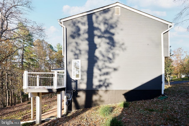 view of home's exterior featuring a deck