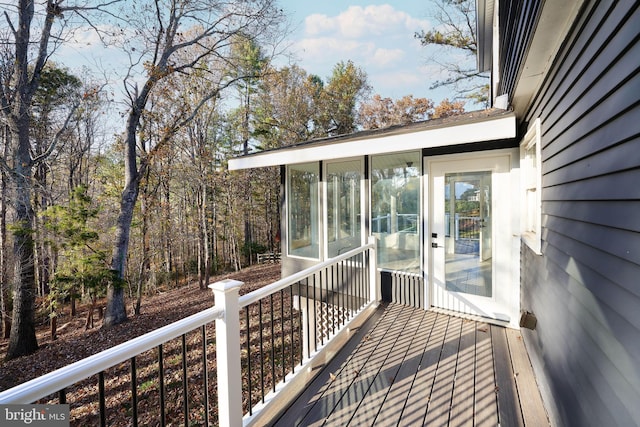 deck with a sunroom