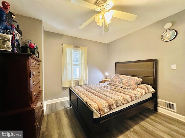 bedroom featuring hardwood / wood-style flooring and ceiling fan