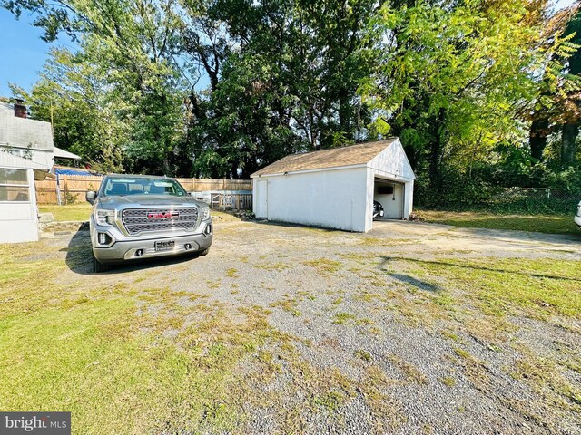 view of yard featuring an outbuilding and a garage