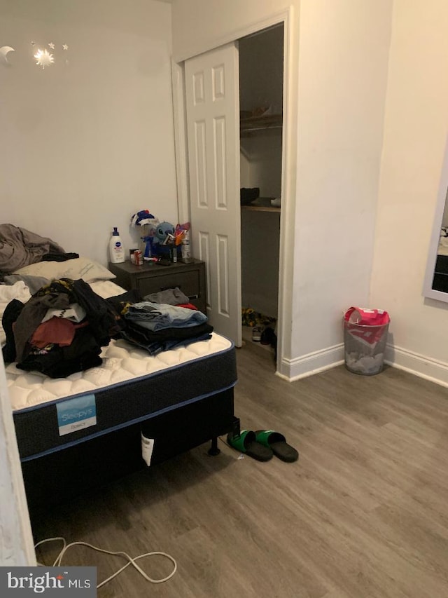 bedroom featuring a closet and hardwood / wood-style floors