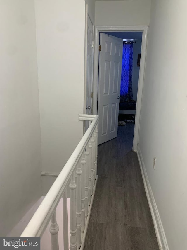 hallway featuring dark hardwood / wood-style floors