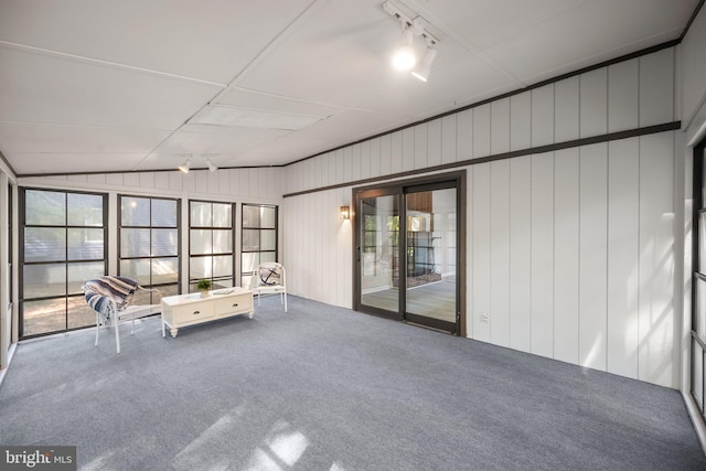 unfurnished sunroom with lofted ceiling and a healthy amount of sunlight